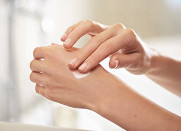 girl applying Diamond Cocoon Sheer Cream on her face